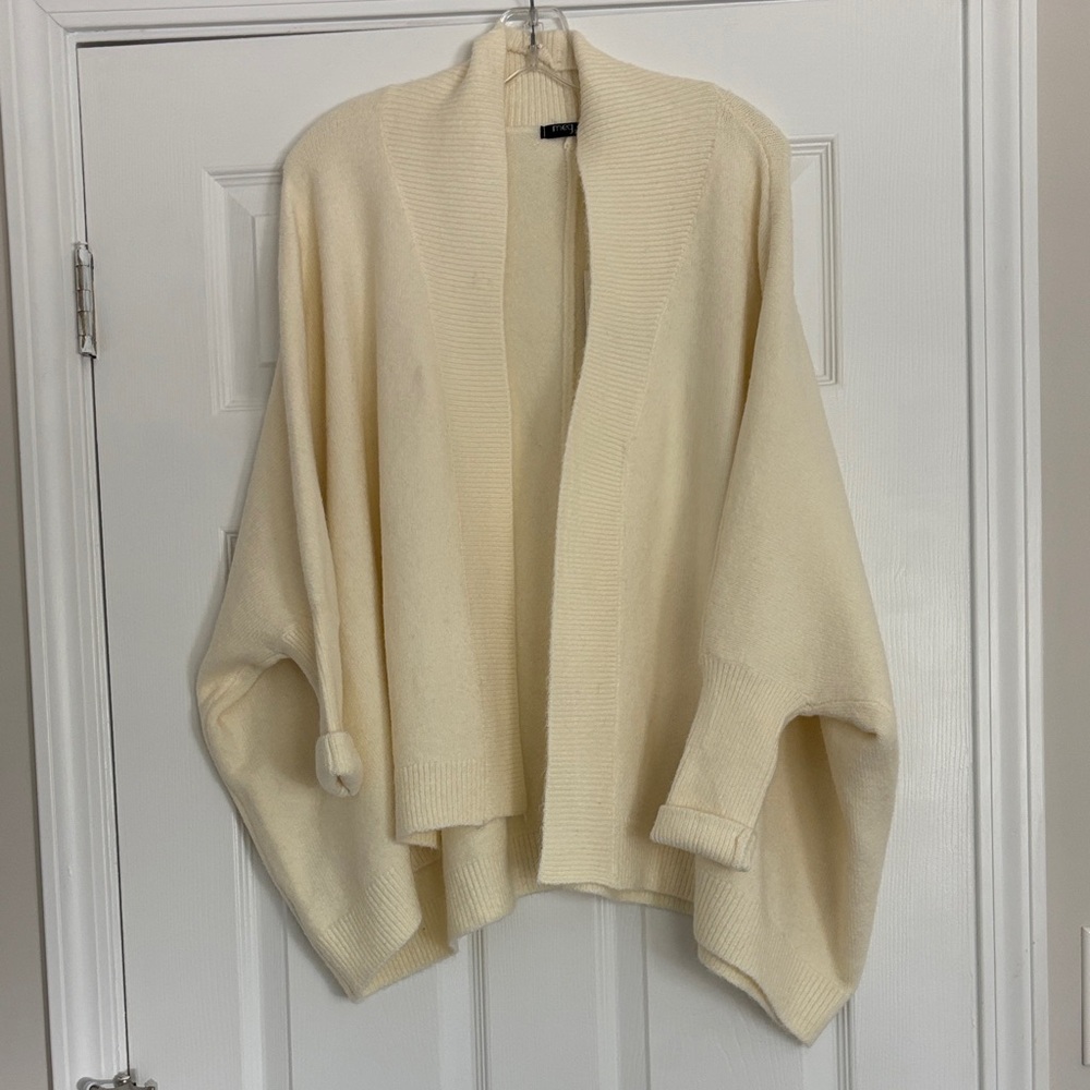 Beautiful cream cozy cardigan. New with tags. One size.